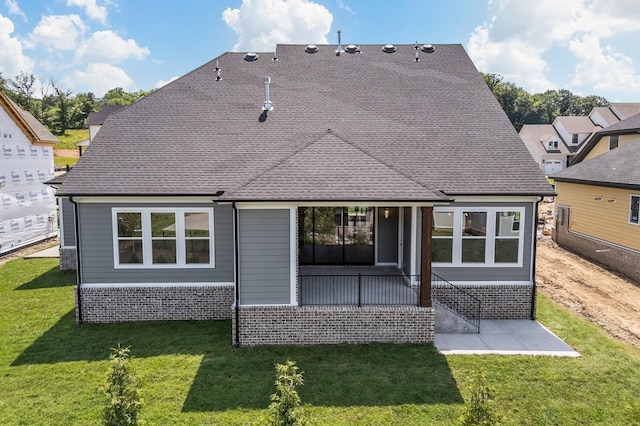 7428 Leelee Dr, Franklin, TN 37064 - rear view of property featuring a yard, a patio area, brick siding, and roof with shingles