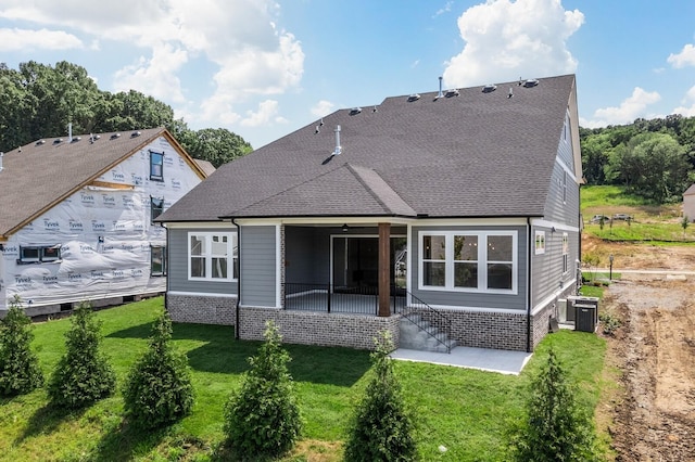 7428 Leelee Dr, Franklin, TN 37064 - rear view of property featuring a patio, a yard, a shingled roof, and brick siding