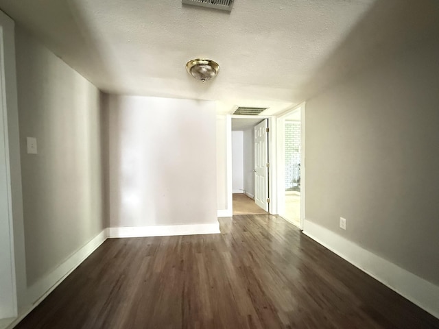 2844 Jarman Hollow Rd, Palmyra, TN 37142 - spare room featuring dark wood finished floors and a textured ceiling