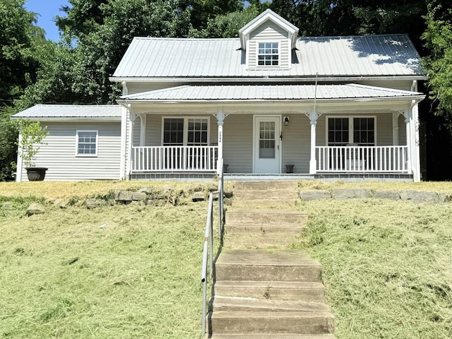 2844 Jarman Hollow Rd, Palmyra, TN 37142 - view of front of property with covered porch, a front lawn, and a metal roof