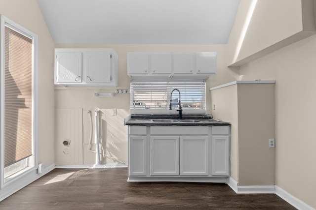 420 E State St E, Murfreesboro, TN 37130 - kitchen featuring vaulted ceiling, dark countertops, white cabinetry, dark wood-type flooring, and healthy amount of natural light