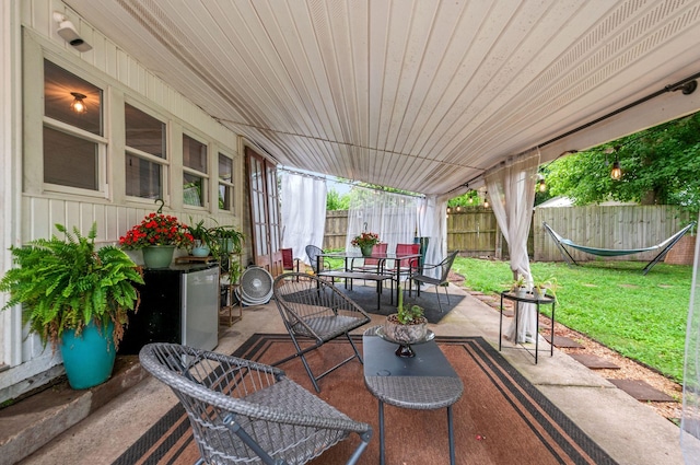 909 W 1st St, Dickson, TN 37055 - fenced backyard with outdoor dining space and a patio area