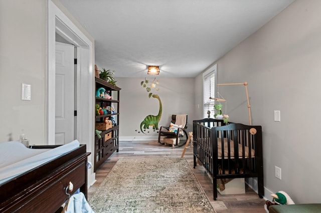 909 W 1st St, Dickson, TN 37055 - hallway featuring wood finished floors and baseboards