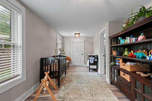 909 W 1st St, Dickson, TN 37055 - corridor featuring light wood-type flooring and baseboards