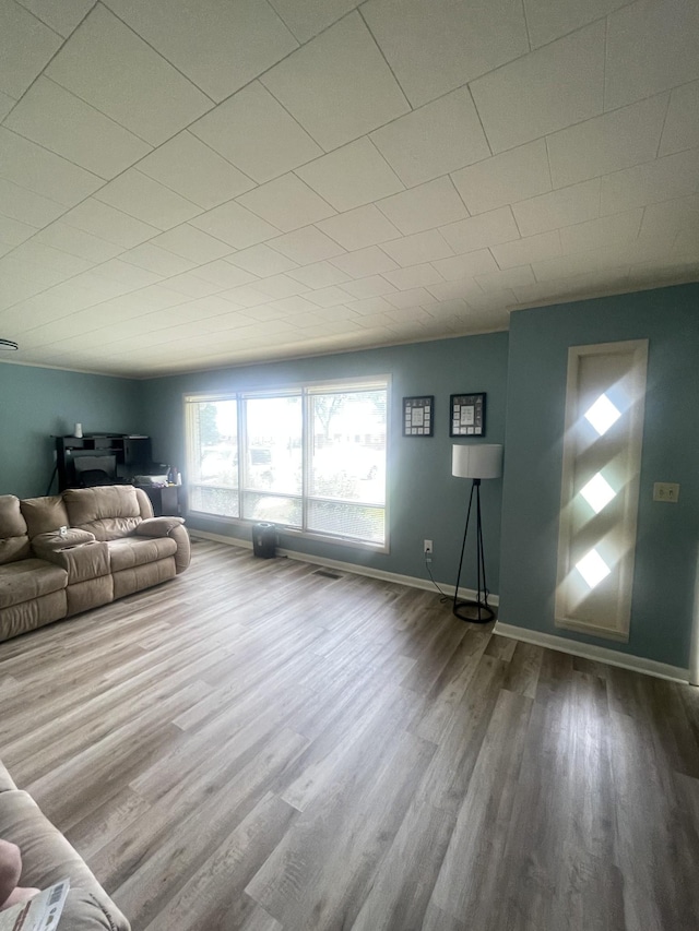 1212 Poplar Dr, Lawrenceburg, TN 38464 - living room featuring wood finished floors and baseboards