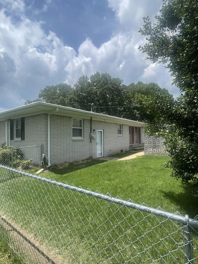 1212 Poplar Dr, Lawrenceburg, TN 38464 - rear view of property featuring brick siding and entry steps