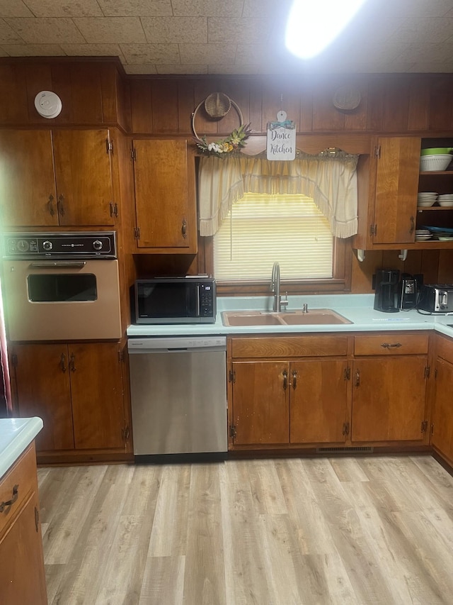 1212 Poplar Dr, Lawrenceburg, TN 38464 - kitchen featuring stainless steel dishwasher, oven, and brown cabinets