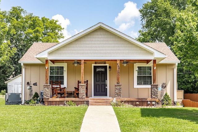 305 Bryant St, Watertown, TN 37184 - bungalow with ceiling fan, covered porch, a front lawn, and board and batten siding
