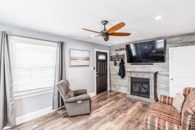 305 Bryant St, Watertown, TN 37184 - living area featuring ceiling fan, wood finished floors, a fireplace, recessed lighting, and wooden walls