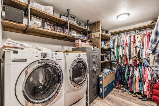 305 Bryant St, Watertown, TN 37184 - laundry room with washer and dryer, wood finished floors, and a textured ceiling