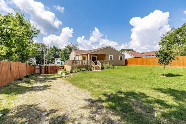 305 Bryant St, Watertown, TN 37184 - back of property with a fenced backyard and a wooden deck