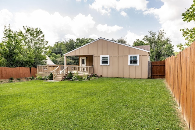 305 Bryant St, Watertown, TN 37184 - rear view of property with a fenced backyard, board and batten siding, and a deck