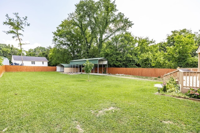 305 Bryant St, Watertown, TN 37184 - fenced backyard featuring a storage unit, a detached carport, and view of wooded area