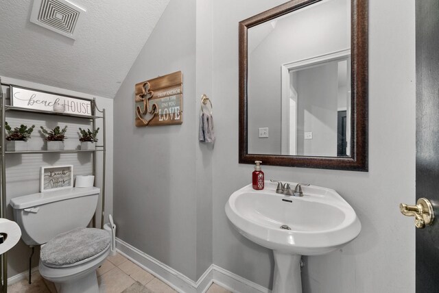 3723 Reed Rd, Indian Mound, TN 37079 - half bathroom featuring lofted ceiling, tile patterned flooring, and a textured ceiling