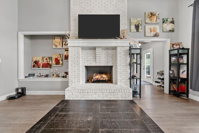 3723 Reed Rd, Indian Mound, TN 37079 - living area with wood finished floors and a brick fireplace