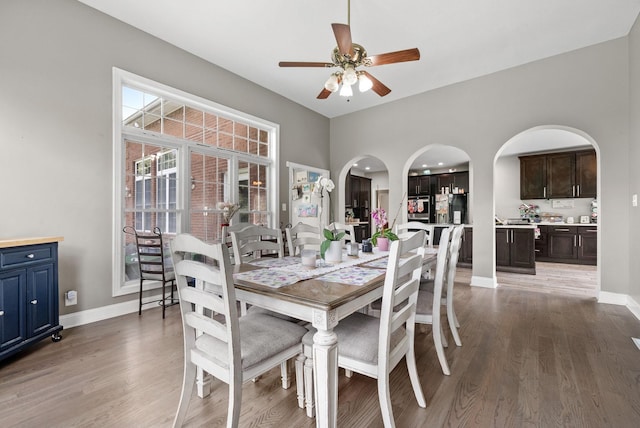 3723 Reed Rd, Indian Mound, TN 37079 - dining room featuring arched walkways, ceiling fan, and light wood-style floors