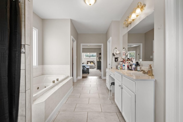 3723 Reed Rd, Indian Mound, TN 37079 - ensuite bathroom featuring a tub with jets, vanity, and tile patterned floors