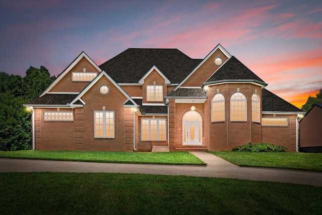 3723 Reed Rd, Indian Mound, TN 37079 - view of front of property with a yard, brick siding, and roof with shingles