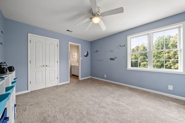 3723 Reed Rd, Indian Mound, TN 37079 - unfurnished bedroom featuring light carpet, a closet, and a ceiling fan