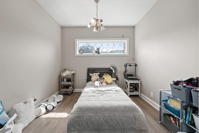 3723 Reed Rd, Indian Mound, TN 37079 - bedroom with wood finished floors and a chandelier