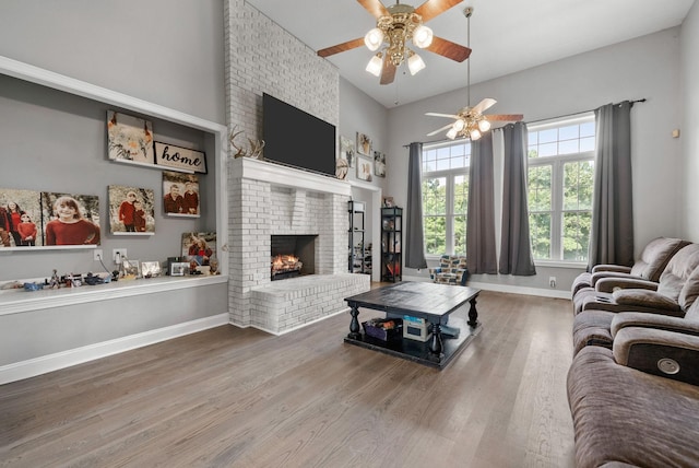 3723 Reed Rd, Indian Mound, TN 37079 - living room featuring wood finished floors, a ceiling fan, and a fireplace