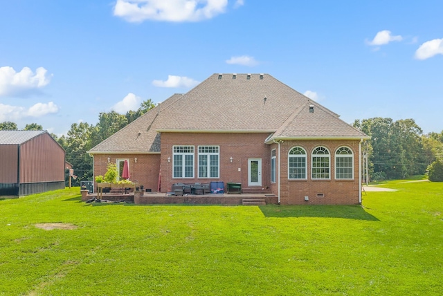 3723 Reed Rd, Indian Mound, TN 37079 - rear view of property featuring a patio area, brick siding, a yard, and a shingled roof