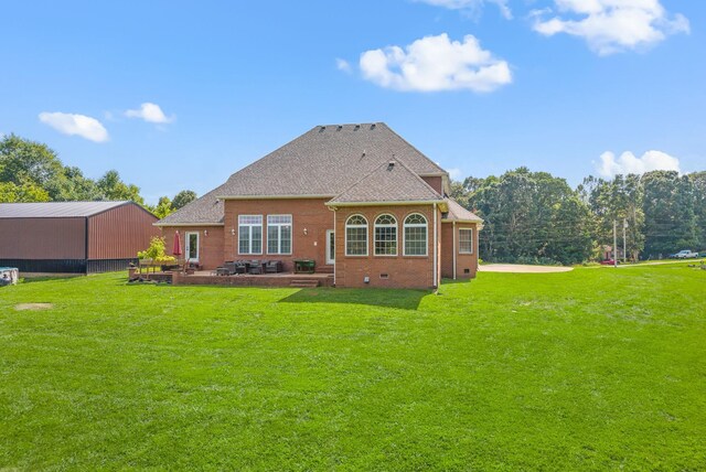 3723 Reed Rd, Indian Mound, TN 37079 - back of house featuring a lawn, crawl space, a patio area, and brick siding