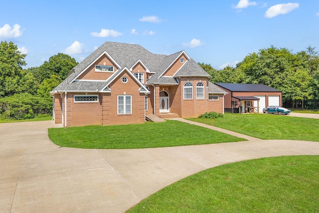 3723 Reed Rd, Indian Mound, TN 37079 - view of front of house featuring driveway, brick siding, a front lawn, and a shingled roof