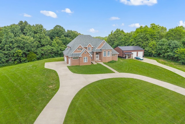 3723 Reed Rd, Indian Mound, TN 37079 - view of front of house featuring driveway, a garage, a front yard, and brick siding