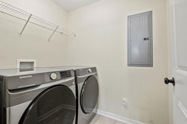 414 Grace St, Springfield, TN 37172 - laundry area featuring independent washer and dryer, electric panel, and light tile patterned floors