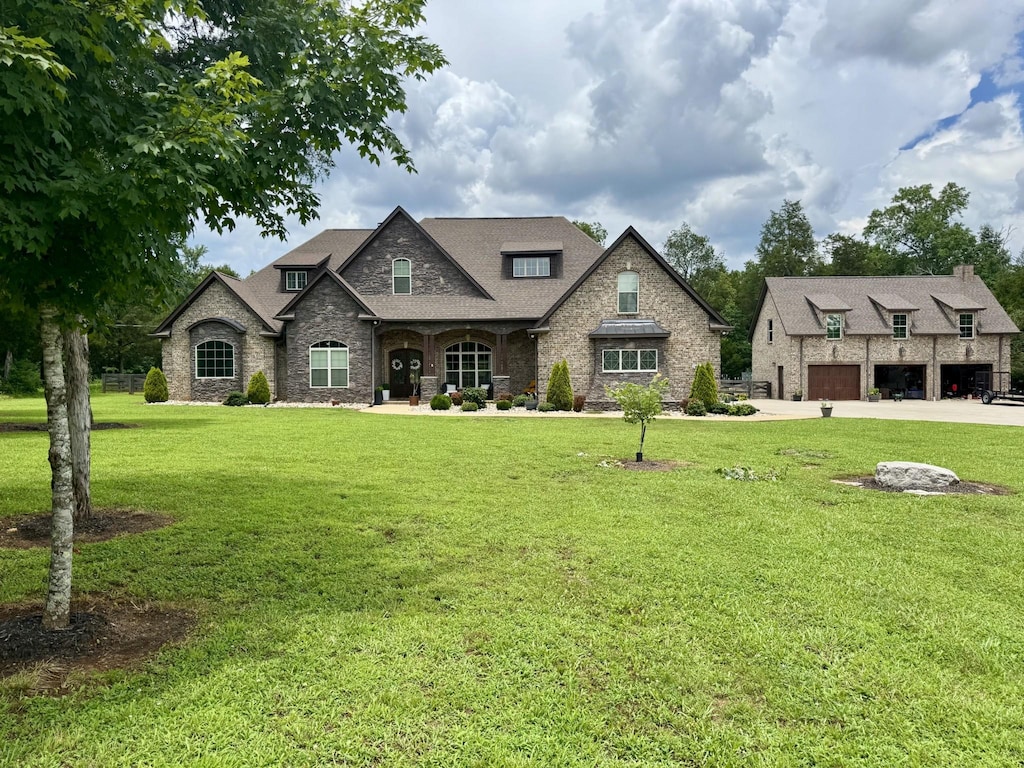 1464 Azalee Ln, Chapel Hill, TN 37034 - french country home featuring a front yard, stone siding, and a garage