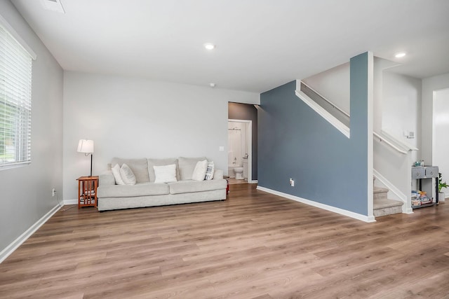 124 Nunally Dr, Baxter, TN 38544 - living room featuring stairway, wood finished floors, and recessed lighting