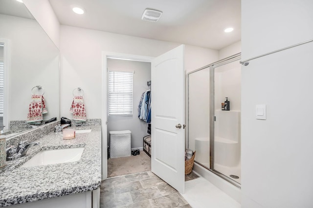124 Nunally Dr, Baxter, TN 38544 - full bathroom with a shower stall, double vanity, and recessed lighting