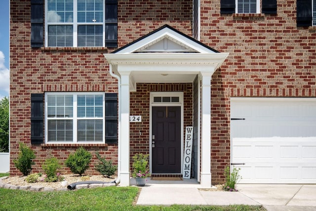 124 Nunally Dr, Baxter, TN 38544 - entrance to property featuring brick siding and an attached garage