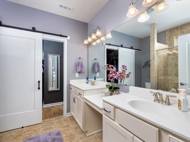 141 Tipton Pass, Spring Hill, TN 37174 - bathroom featuring vanity, tiled shower, and tile patterned flooring