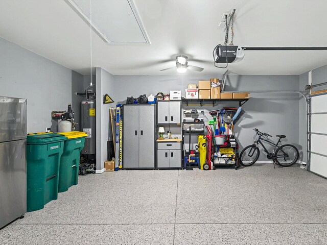 141 Tipton Pass, Spring Hill, TN 37174 - garage with a garage door opener, electric water heater, freestanding refrigerator, and ceiling fan