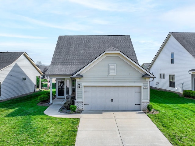 141 Tipton Pass, Spring Hill, TN 37174 - traditional-style home featuring concrete driveway, a front yard, and a shingled roof