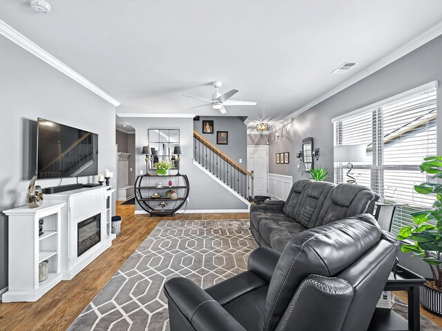 141 Tipton Pass, Spring Hill, TN 37174 - living area with stairway, crown molding, ceiling fan, and wood finished floors