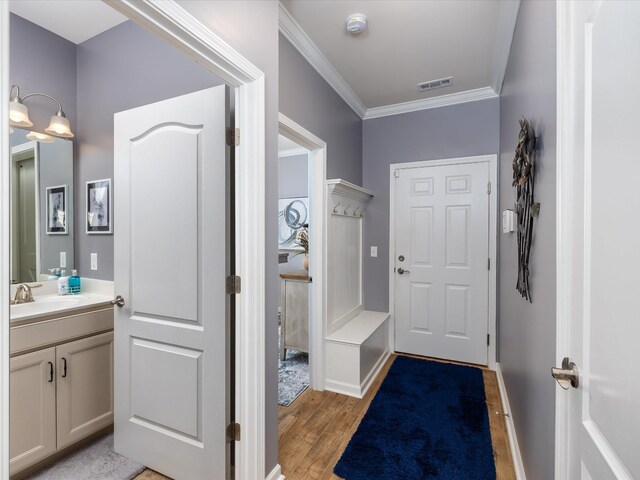 141 Tipton Pass, Spring Hill, TN 37174 - mudroom with light wood-style flooring and ornamental molding