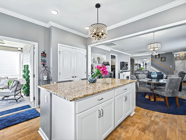 141 Tipton Pass, Spring Hill, TN 37174 - kitchen featuring a chandelier, healthy amount of natural light, light wood-type flooring, crown molding, and recessed lighting