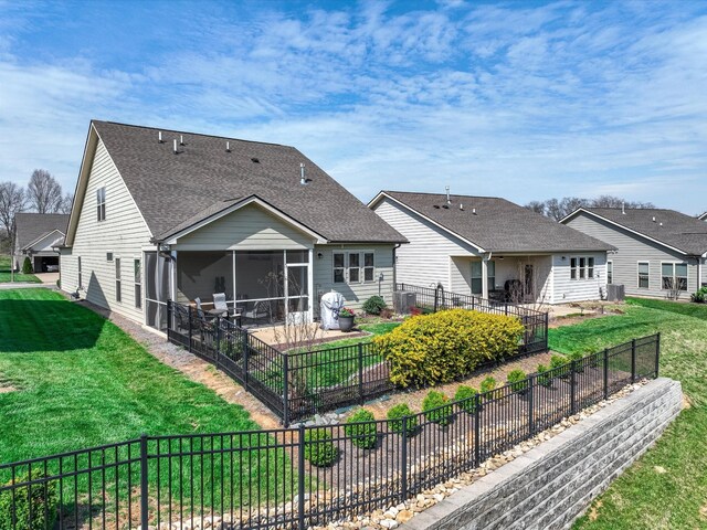 141 Tipton Pass, Spring Hill, TN 37174 - rear view of house with a sunroom, a fenced backyard, roof with shingles, and a patio