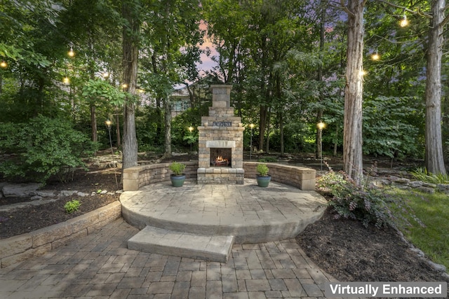 2188 Capistrano Way, Nolensville, TN 37135 - patio terrace at dusk with an outdoor stone fireplace and a patio