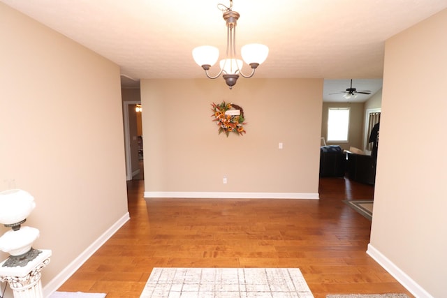 120 Mai Ridge Ln, Lafayette, TN 37083 - unfurnished dining area with light wood finished floors, ceiling fan, and a chandelier