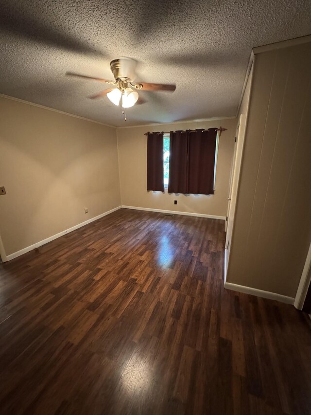 3911 Old Bottom Rd, Lafayette, TN 37083 - spare room with dark wood finished floors, ceiling fan, a textured ceiling, and crown molding