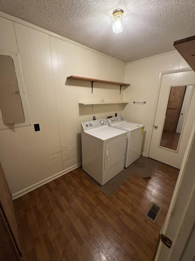 3911 Old Bottom Rd, Lafayette, TN 37083 - washroom featuring a textured ceiling, dark wood-style flooring, electric panel, and washer and dryer