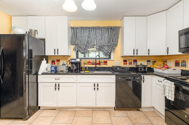 1211 Haber Dr, Brentwood, TN 37027 - kitchen featuring black appliances, white cabinetry, and light tile patterned floors