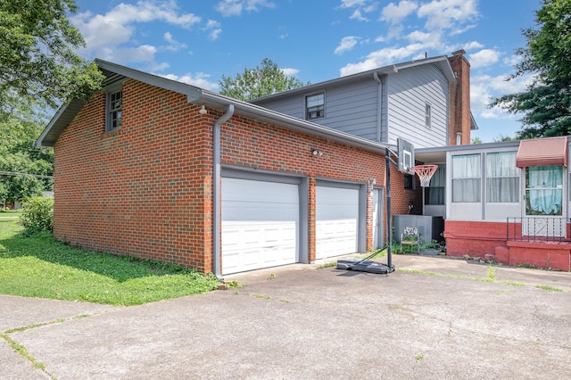 1211 Haber Dr, Brentwood, TN 37027 - view of side of home with brick siding, asphalt driveway, and a garage
