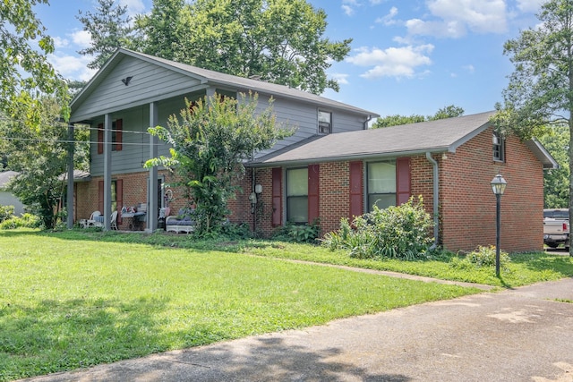 1211 Haber Dr, Brentwood, TN 37027 - traditional-style house with brick siding and a front lawn