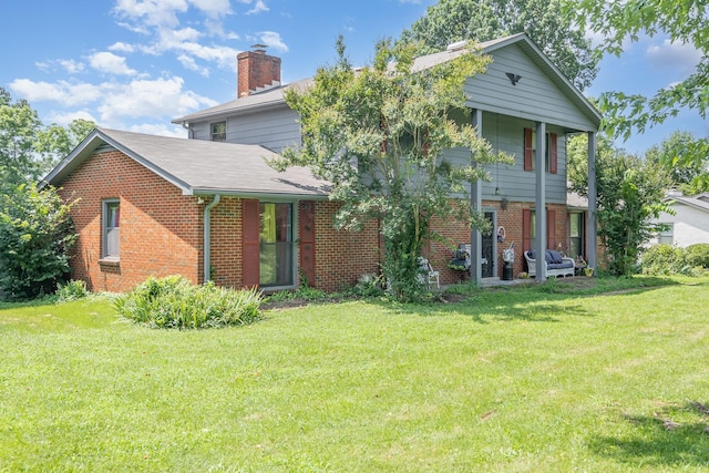 1211 Haber Dr, Brentwood, TN 37027 - view of front of home with brick siding, a front yard, and a chimney
