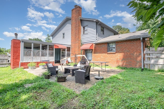 1211 Haber Dr, Brentwood, TN 37027 - back of property with a patio area, a chimney, brick siding, and a lawn